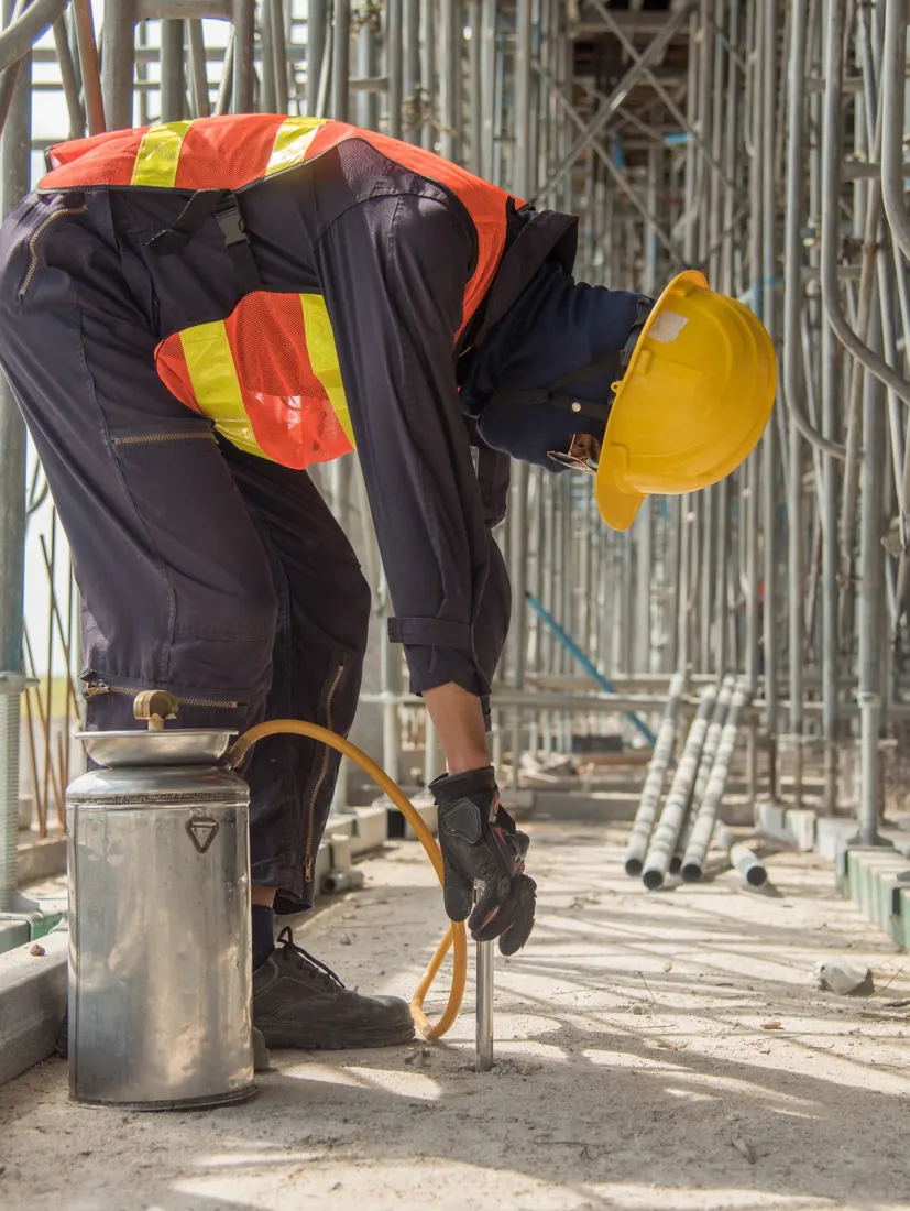 Construction worker preparing materials on site